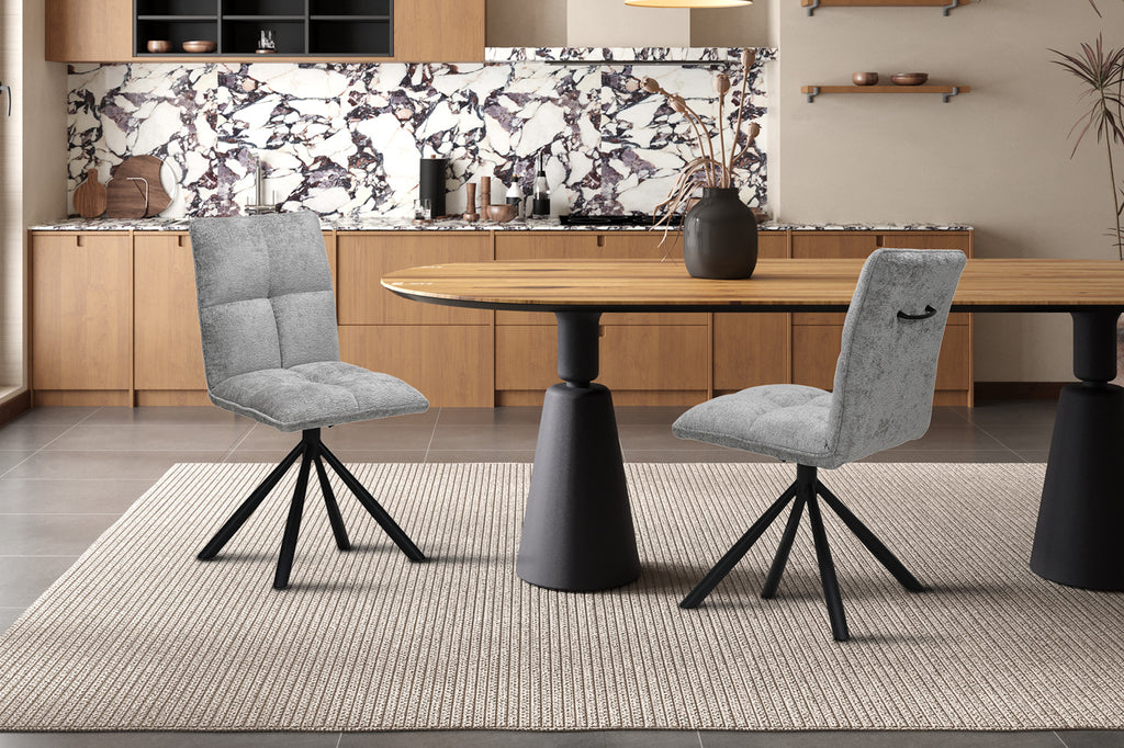 Draaibare stoel 'Jack' in lichtgrijs stof met zwarte metalen poten, geplaatst voor een marmeren aanrecht, met bijpassende stoel. Verpakt per twee.