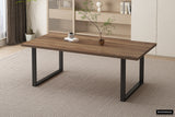 Tafel 'Alexander' 200 cm Decor Mango met een plant in een glazen vaas erop, geplaatst in een interieur met gordijnen en ventilatierooster.