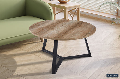 Salontafel 'Paso 1' Decor Oude Eik met ronde houten blad en zwarte poten, geplaatst voor een groene stoel, straalt structuur en design uit.