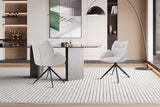 Stoel 'Mahi' Draaibaar tot 0 Stof Ote Share 101 Beige, witte stoel met zwarte poten in een moderne kameropstelling.
