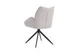 Stoel 'Mahi' Draaibaar tot 0, met witte bekleding en zwarte poten, ideaal voor moderne interieurs. Verkocht in sets van twee bij Furndaily.