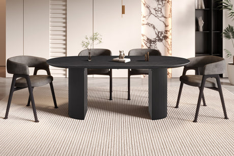 Tafel 'Lagos' 200 cm ovaal met MDF-structuur, decor donkerbruin, met een boek en beeld op het blad, omringd door stoelen.