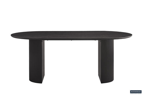 Tafel 'Lagos' 200 cm Ovaal Decor Donkerbruin met stevige metalen poten en MDF-structuur, zichtbaar als een elegante zwarte tafel met een robuust ontwerp.