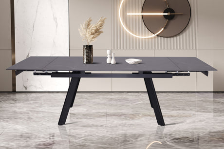 Uitschuifbare tafel 'Hera' 160-240 cm, rechthoekig, metaalstructuur, stenen blad, zichtbaar met vaas en decoratieve elementen erop.